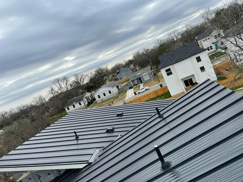 Standing seam metal roof panels with vents for Skylight Repair in Plano